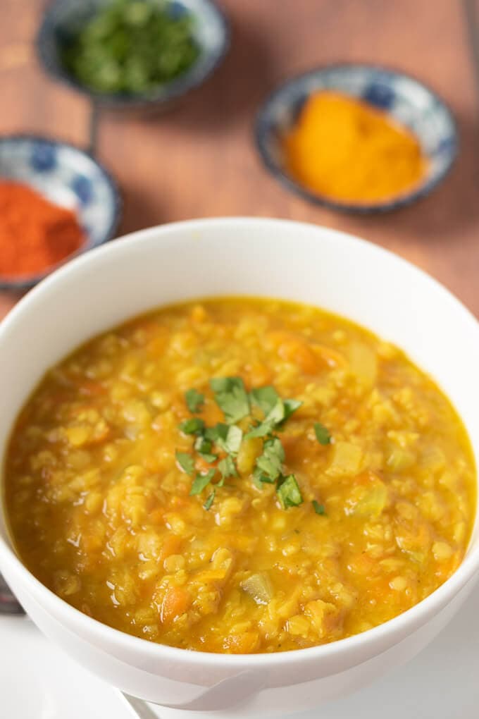 Closeup of bowl of currued red lentil soup. Looks delicious and ready to eat!